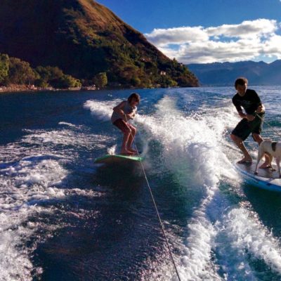 family and dog wake SUPsurfing