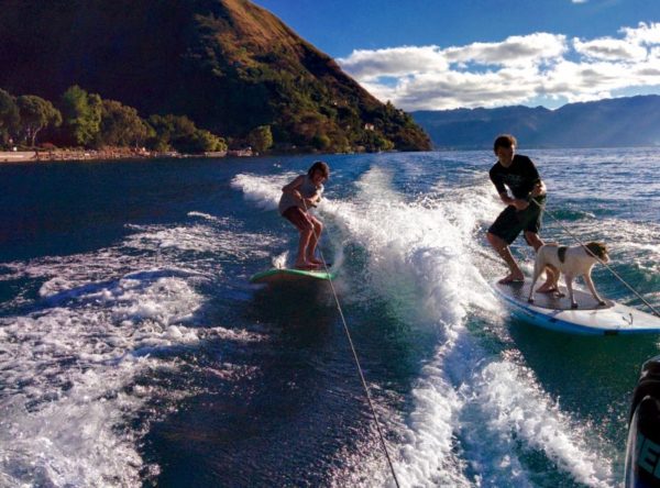 family and dog wake SUPsurfing