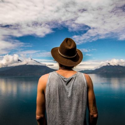 guy looking at lake atitlan volcano